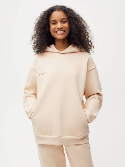 mujer sudadera con capucha de la firma Pangaia arena ropa TDTH20