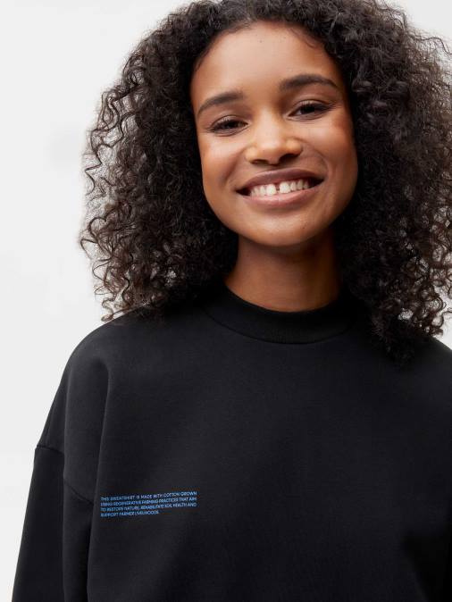 mujer en sudadera de algodón de conversión Pangaia negro ropa TDTH109
